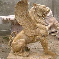 Yellow travertine winged lion statue